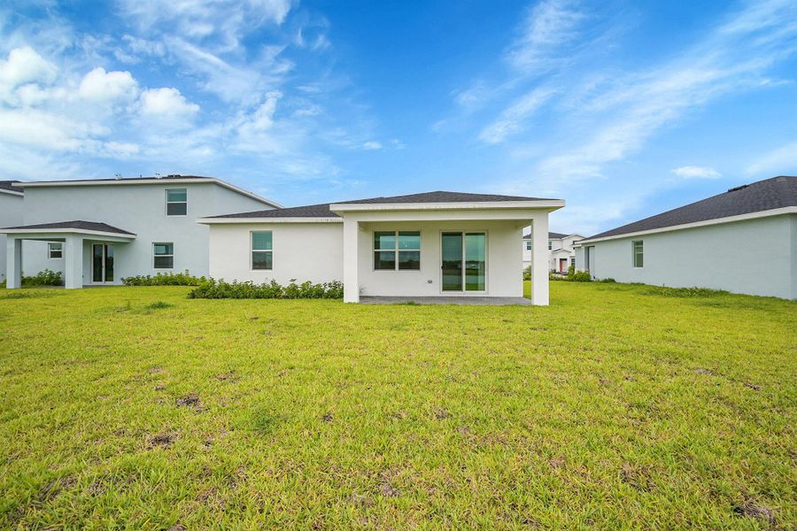 Front exterior of a new home in Seagrove: The Indies, Fort Pierce, FL, highlighting curb appeal (Image 16).