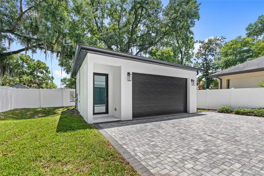 Front exterior of a new home in College Park, Orlando, FL, highlighting curb appeal (Image 1). Front exterior of a new home in College Park, Orlando, FL, highlighting curb appeal (Image 1).