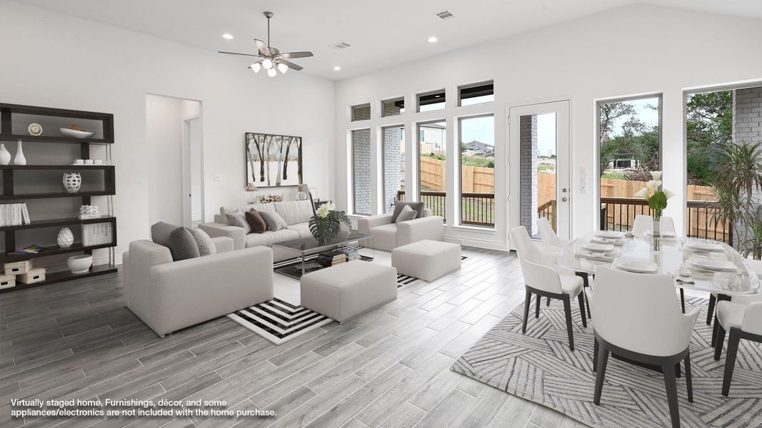 Living area with ceiling fan, wood finished floors, and recessed lighting