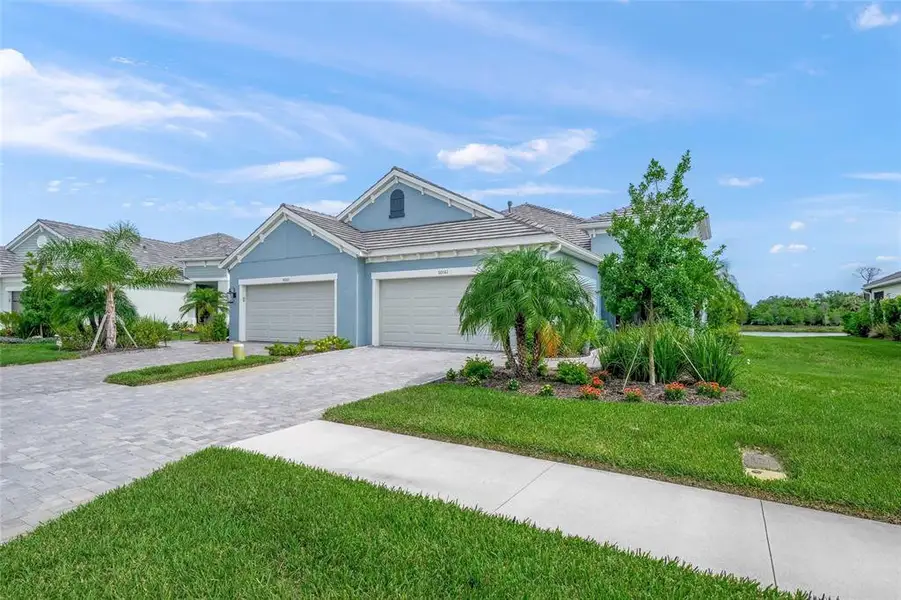 Front exterior of a new home in , Sarasota, FL, highlighting curb appeal (Image 2). Front exterior of a new home in , Sarasota, FL, highlighting curb appeal (Image 2).