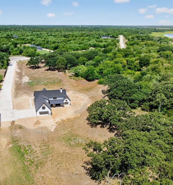 Stunning aerial picture showcasing the magnificent 1.56 acre lot surrounded by mature trees. Stunning aerial picture showcasing the magnificent 1.56 acre lot surrounded by mature trees.