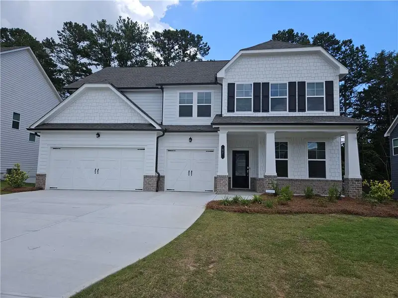 Front exterior of a new home in Park at Ansleigh Farms, Dallas, GA, highlighting curb appeal (Image 2).
