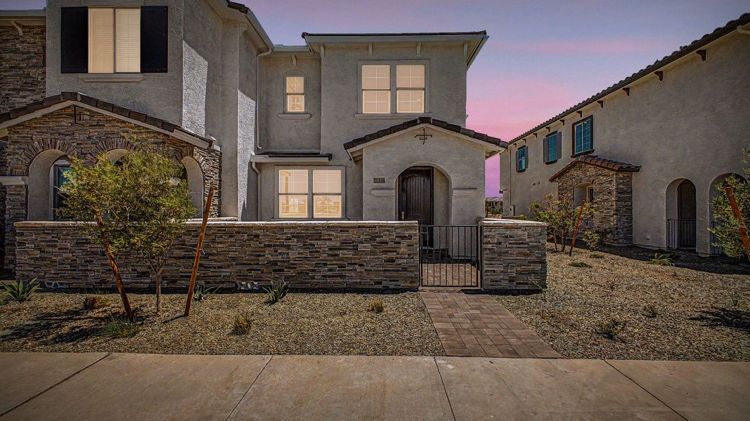 Front exterior of a new home in Surprise City Center, Surprise, AZ, highlighting curb appeal (Image 21).