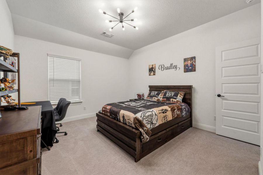 Bedroom with a walk-in closet and ensuite bathroom.