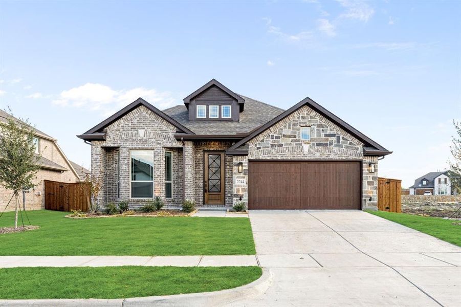 Front exterior of a new home in Sonoma Verde, McLendon-Chisholm, TX, highlighting curb appeal (Image 2).