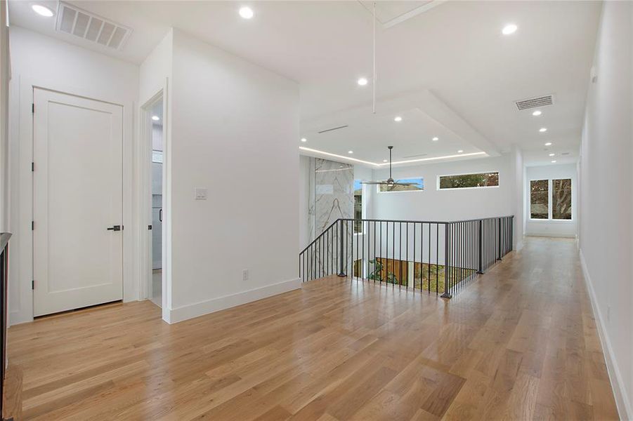 Corridor featuring light hardwood / wood-style flooring