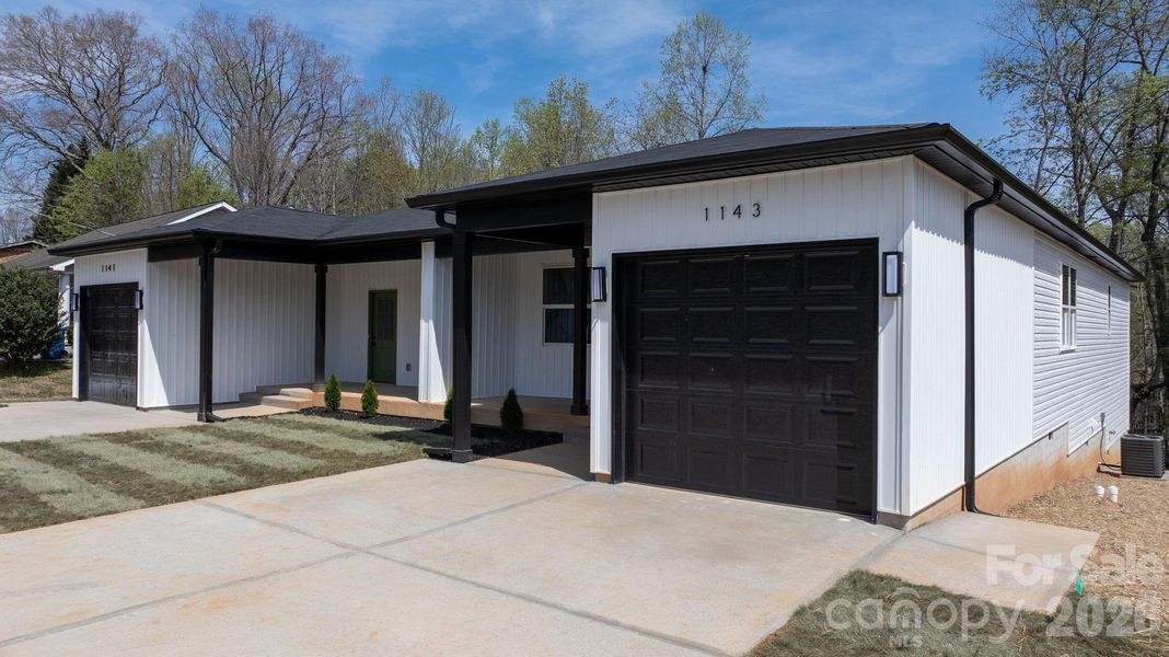 Front exterior of a new home in , Hickory, NC, highlighting curb appeal (Image 23).