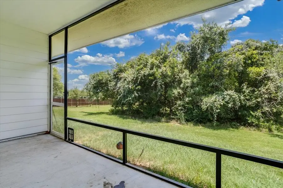 Screened patio with concrete flooring and white horizontal siding