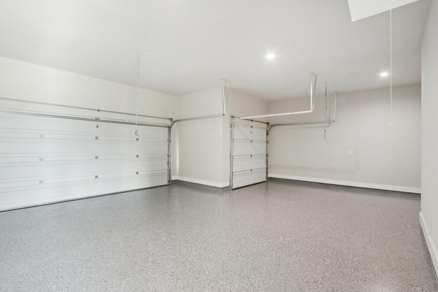 Three car garage with epoxied floors Three car garage with epoxied floors