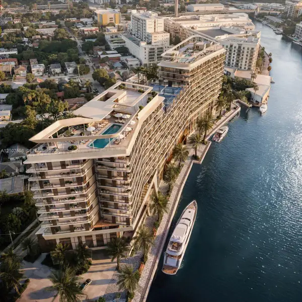 Waterfront high-rise building featuring multiple rooftop swimming pools, wrap-around balconies, a private boat slip, and landscaped grounds with palm trees Waterfront high-rise building featuring multiple rooftop swimming pools, wrap-around balconies, a private boat slip, and landscaped grounds with palm trees