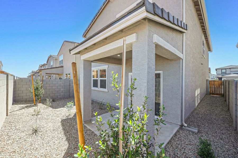 A house with a fence around it. A house with a fence around it.