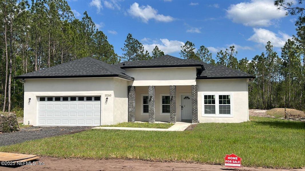 Front exterior of a new home in , Hastings, FL, highlighting curb appeal (Image 14). Front exterior of a new home in , Hastings, FL, highlighting curb appeal (Image 14).