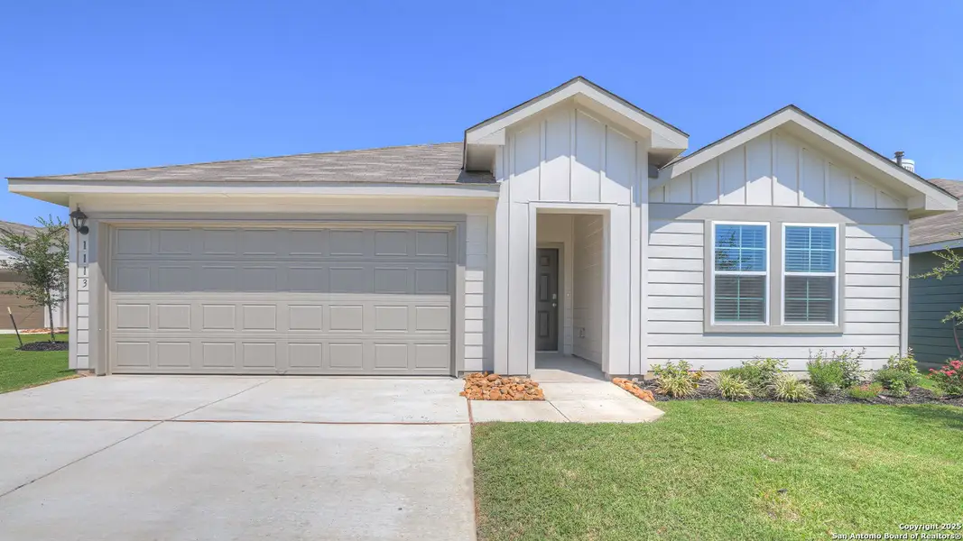 Front exterior of a new home in Navarro Fields, Seguin, TX, highlighting curb appeal (Image 1).