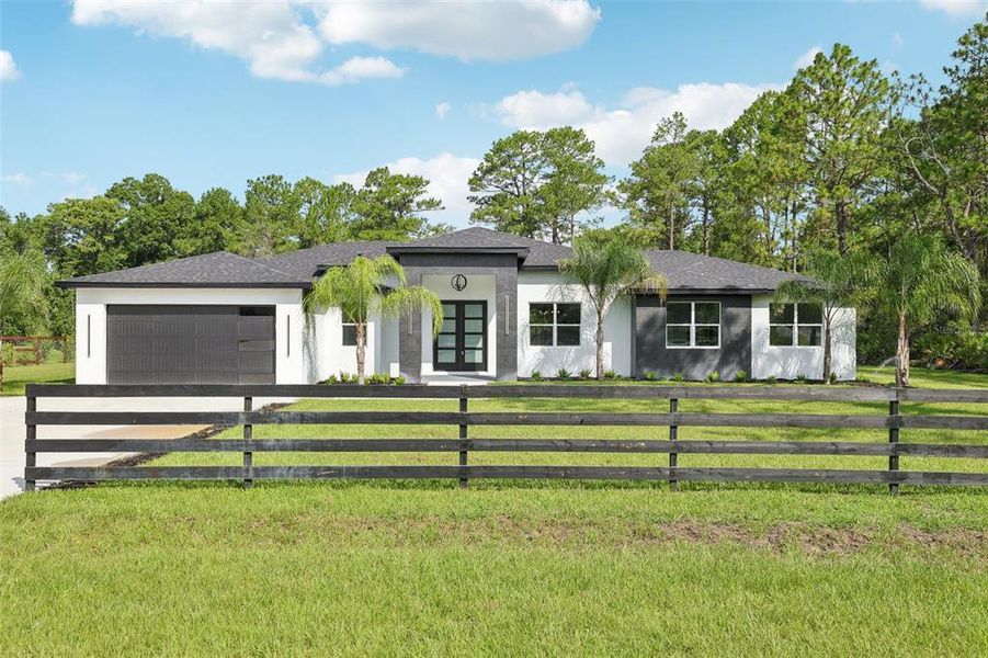Front exterior of a new home in , Eustis, FL, highlighting curb appeal (Image 1). Front exterior of a new home in , Eustis, FL, highlighting curb appeal (Image 1).
