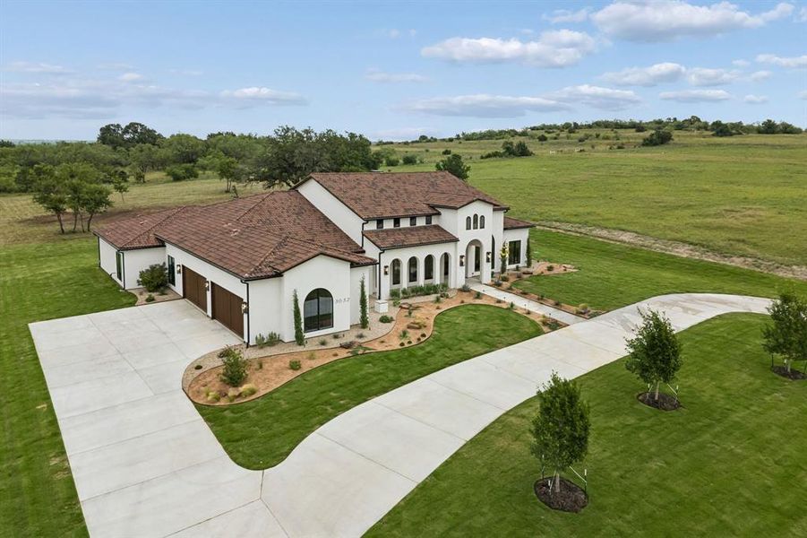 Front exterior of a new home in , Weatherford, TX, highlighting curb appeal (Image 25). Front exterior of a new home in , Weatherford, TX, highlighting curb appeal (Image 25).