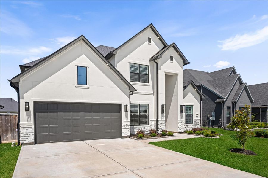 Front exterior of a new home in , Friendswood, TX, highlighting curb appeal (Image 2). Front exterior of a new home in , Friendswood, TX, highlighting curb appeal (Image 2).