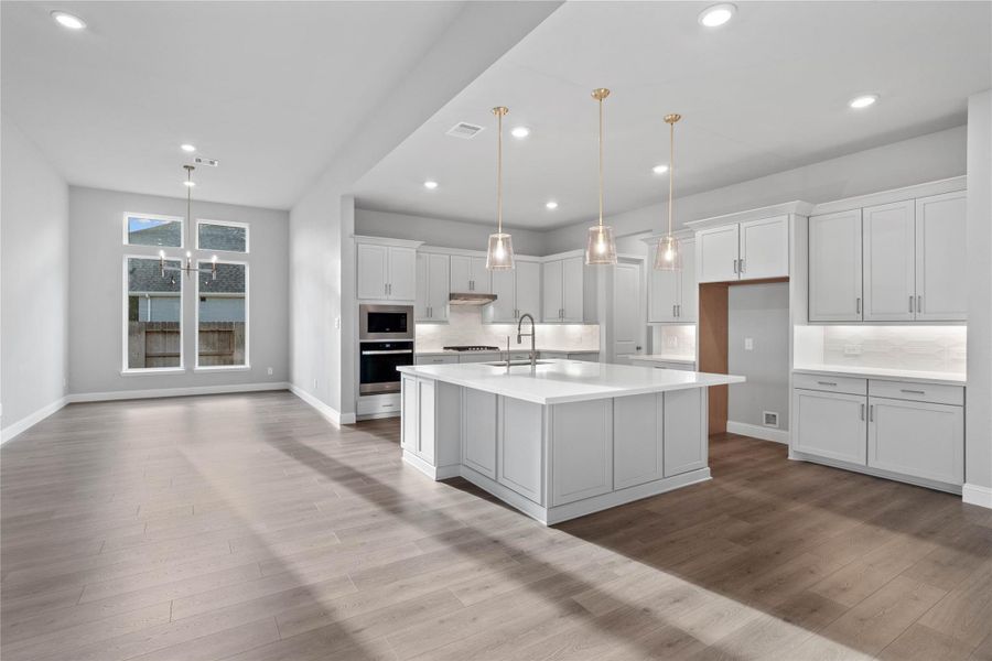 The intentional open design fosters a deep sense of connection between all three primary living zones. Sightlines remain clear from the sink to the breakfast table, promoting inclusive living and effortless entertaining.