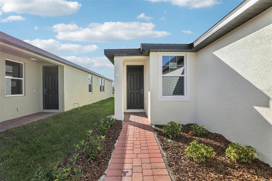 Exterior details and patio area of a home in Lake Deer Estates - Classic Series, Poinciana (Image 18).