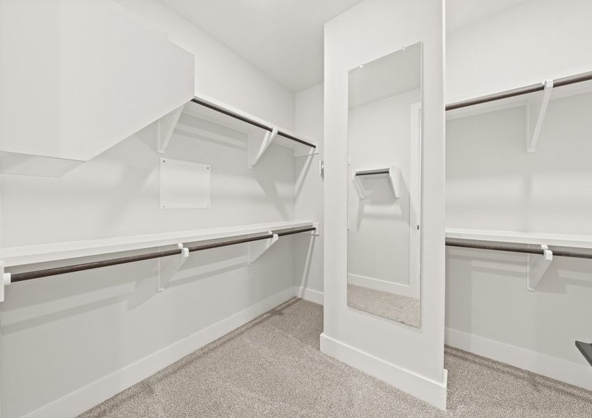 The walk-in, master closet has plenty of hanging and shelf space.