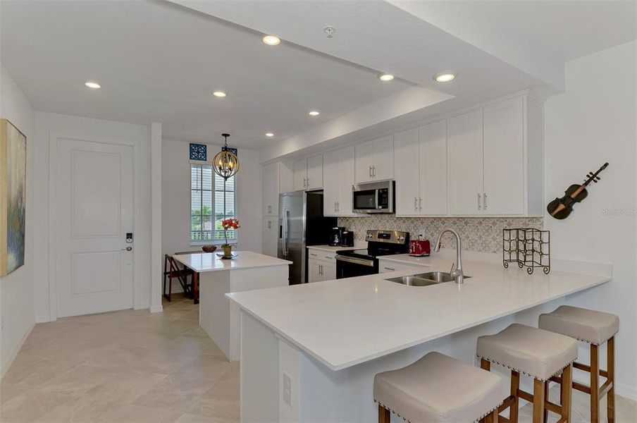 Furnished interior view inside a new home in Wellen Park Golf & Country Club, Venice (Image 29).