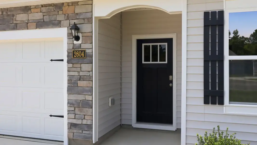 Exterior details and patio area of a home in Villa Grande, Winterville (Image 3).