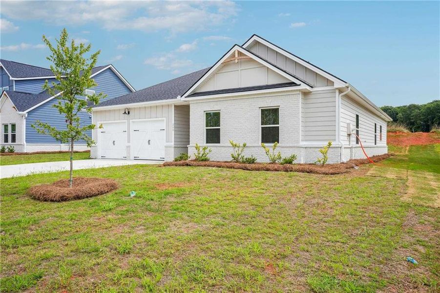 Front exterior of a new home in Conner Springs, Social Circle, GA, highlighting curb appeal (Image 19).