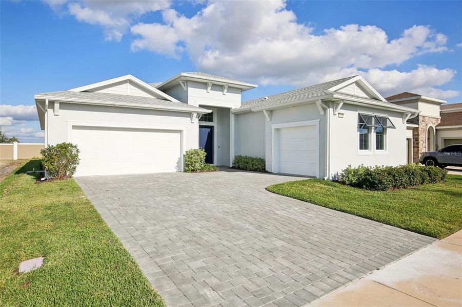 Front exterior of a new home in Eagles Cove at Mirada, San Antonio, FL, highlighting curb appeal (Image 24).