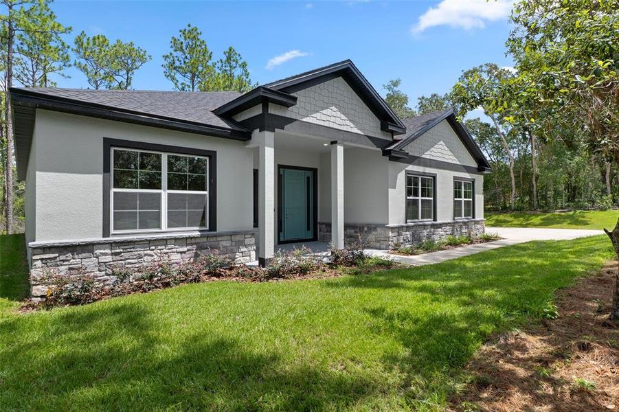 Front exterior of a new home in , Hernando, FL, highlighting curb appeal (Image 27). Front exterior of a new home in , Hernando, FL, highlighting curb appeal (Image 27).