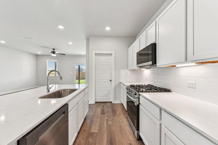 Furnished interior view inside a new home in Stallion Run, Buda (Image 8).