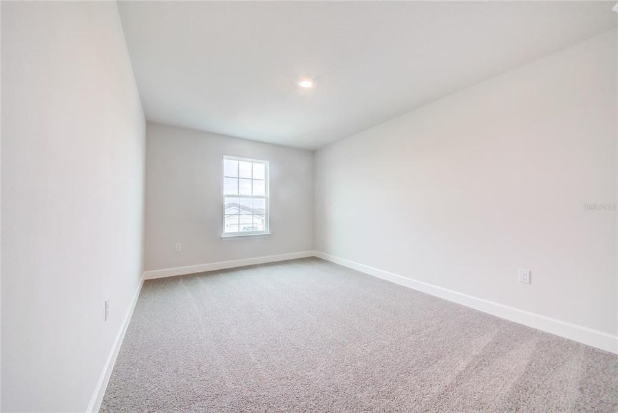 Spacious, unfurnished interior of a new home in Aviary at Rutland Ranch, Parrish (Image 10).