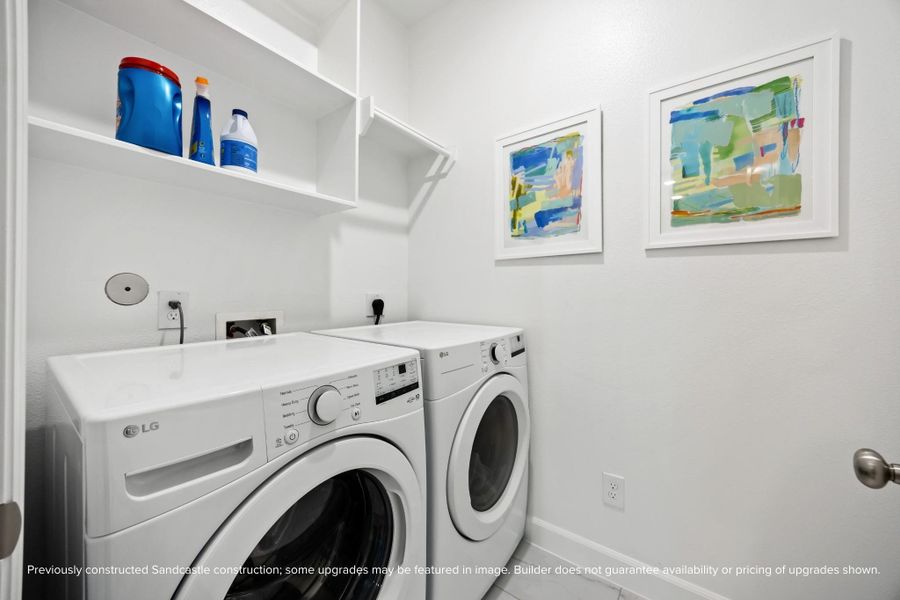 Laundry just got a little more luxe. With floating shelves, built-ins, and cheerful design touches, this space makes chores a little less… chore-like. (Actual features may vary.)