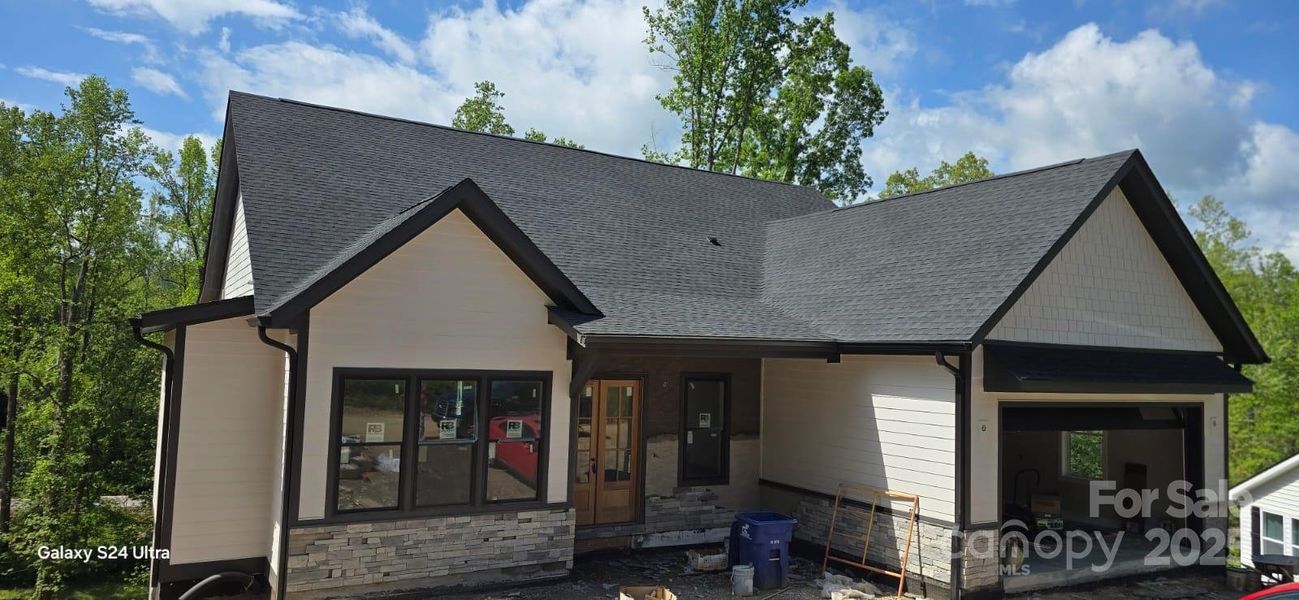 Front exterior of a new home in , Arden, NC, highlighting curb appeal (Image 1).
