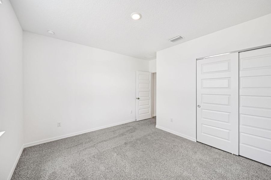 Spacious, unfurnished interior of a new home in Hampton Park - Classic Series, Vero Beach (Image 12).