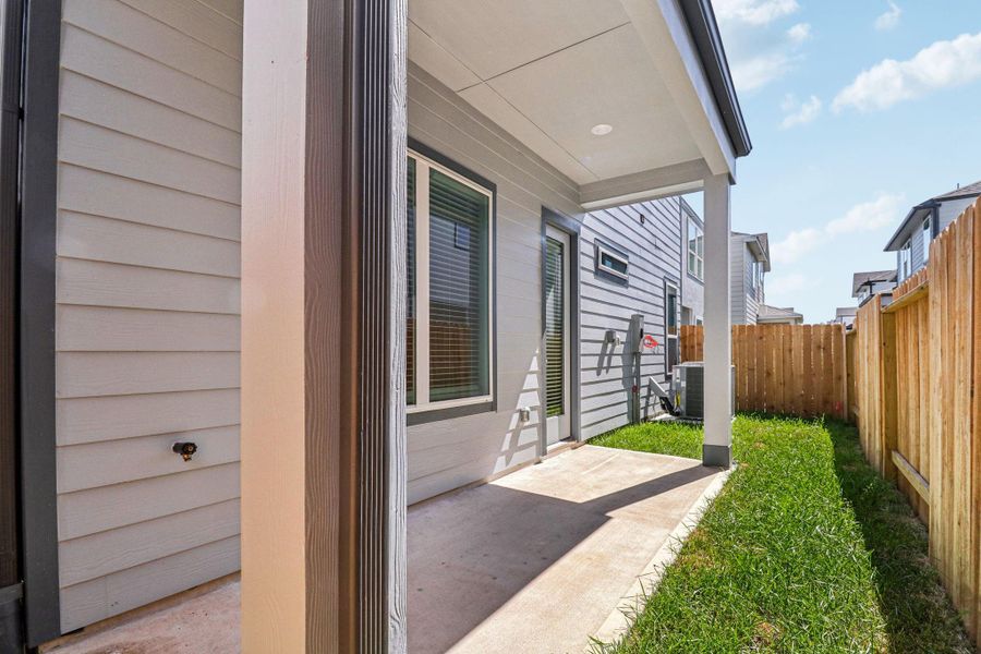 Exterior details and patio area of a home in Spring Brook Village - Luxe Series, Houston (Image 4). Exterior details and patio area of a home in Spring Brook Village - Luxe Series, Houston (Image 4).