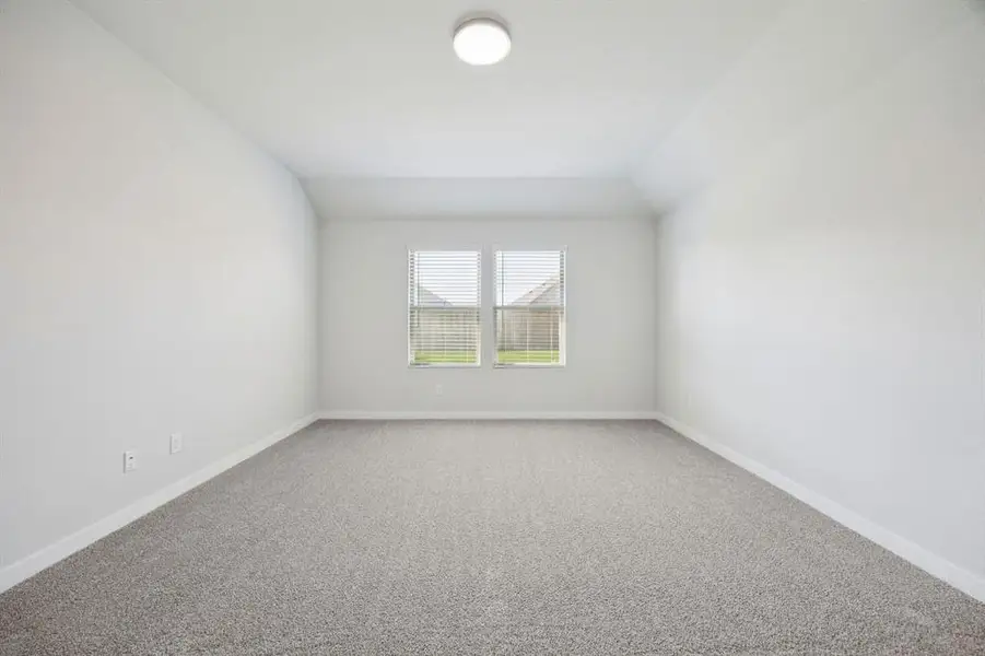 Primary Suite in the Heisman home plan by Trophy Signature Homes – REPRESENTATIVE PHOTO