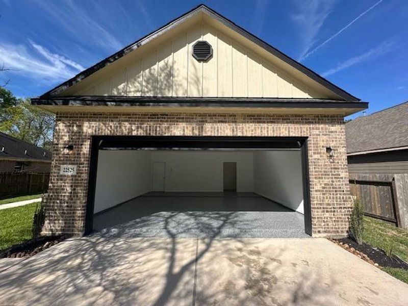 Front exterior of a new home in , Huffman, TX, highlighting curb appeal (Image 1). Front exterior of a new home in , Huffman, TX, highlighting curb appeal (Image 1).