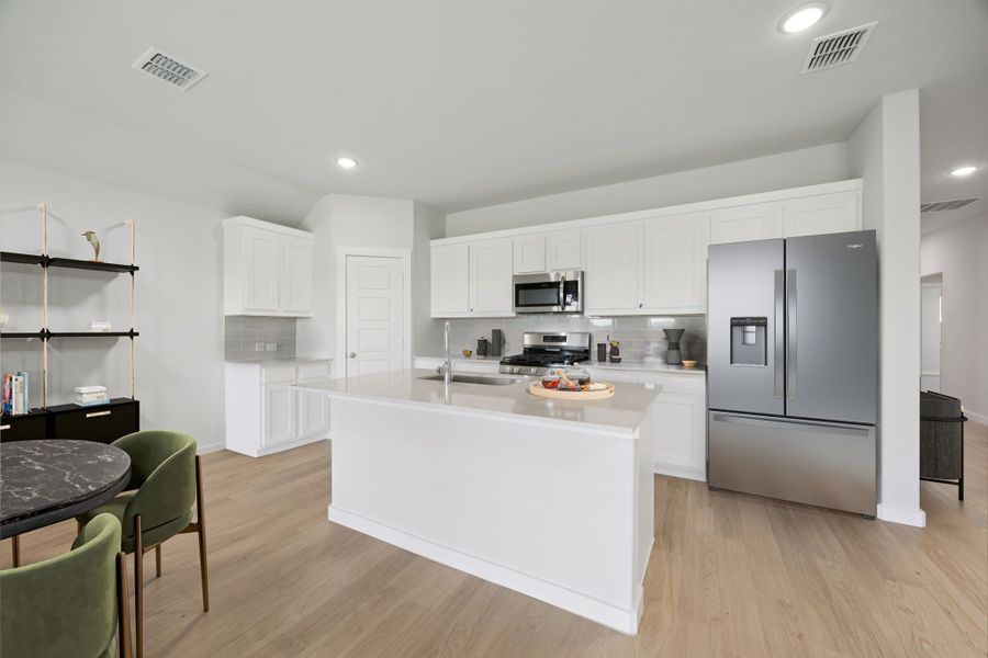 Kitchen in the Hadley home plan by Trophy Signature Homes – REPRESENTATIVE PHOTO Kitchen in the Hadley home plan by Trophy Signature Homes – REPRESENTATIVE PHOTO