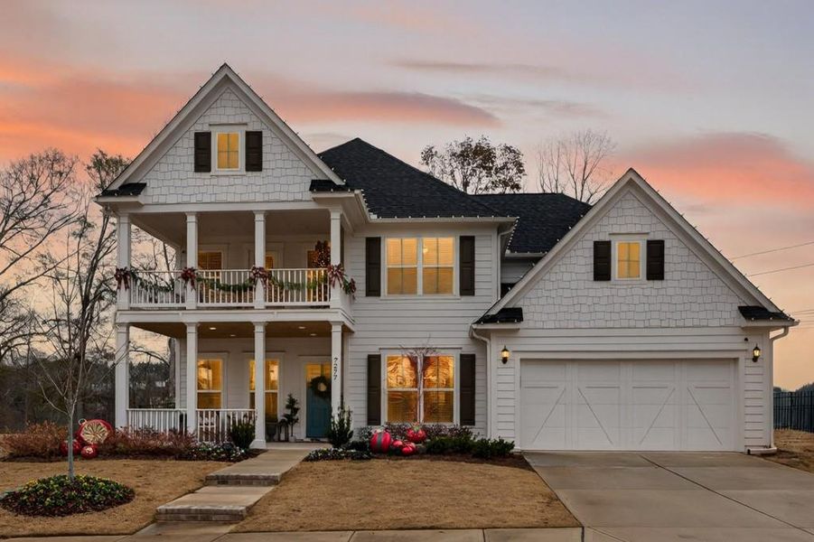 Front exterior of a new home in Reunion, Flowery Branch, GA, highlighting curb appeal (Image 21). Front exterior of a new home in Reunion, Flowery Branch, GA, highlighting curb appeal (Image 21).
