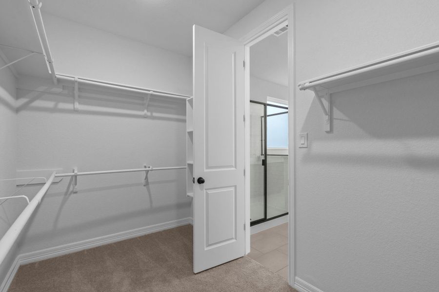 A view of your large primary walk-in Closet