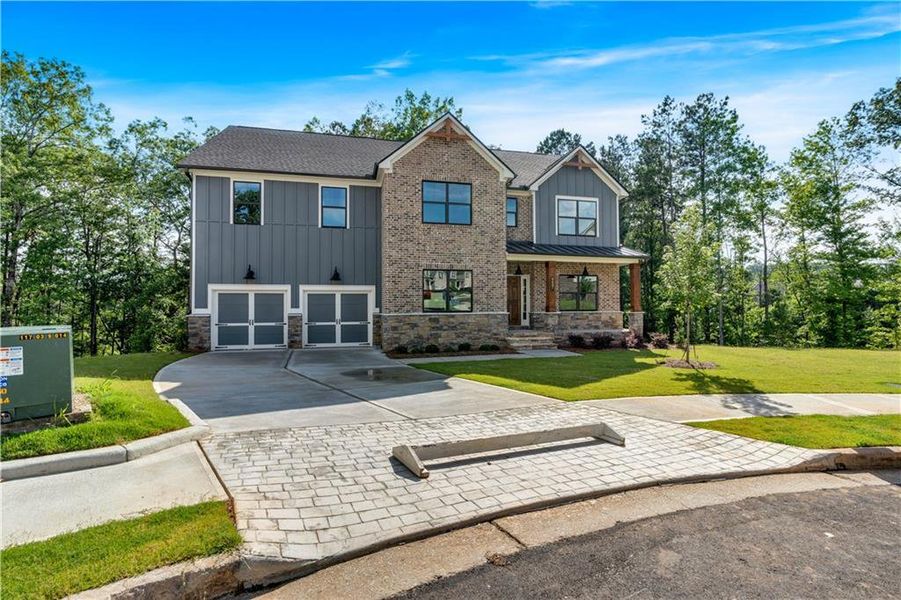 Front exterior of a new home in Palmer Falls, Douglasville, GA, highlighting curb appeal (Image 19).
