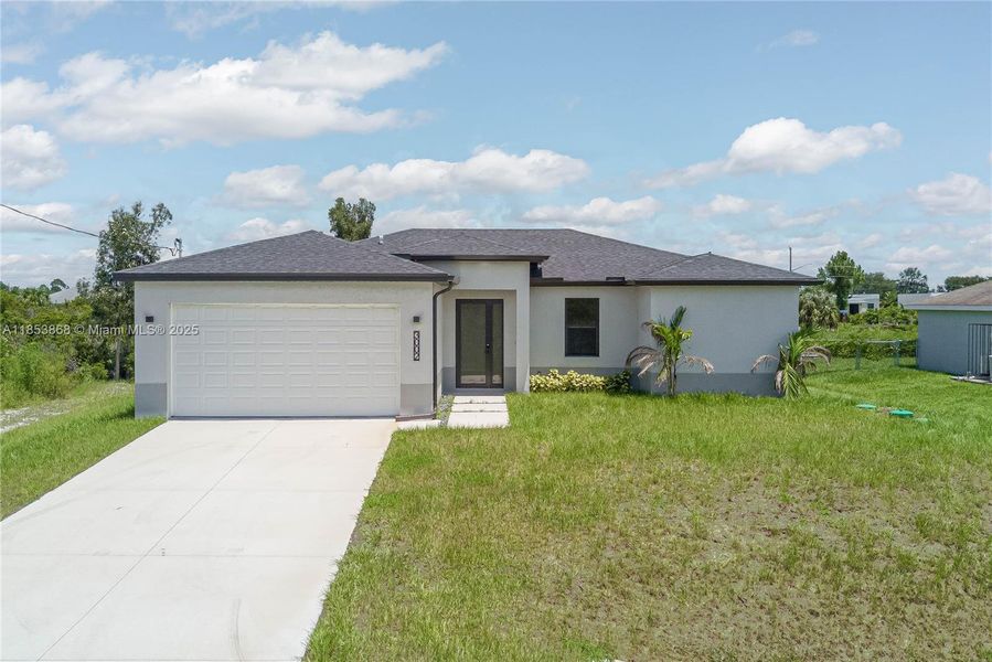 Front exterior of a new home in , Lehigh Acres, FL, highlighting curb appeal (Image 1). Front exterior of a new home in , Lehigh Acres, FL, highlighting curb appeal (Image 1).