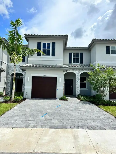 Front exterior of a new home in , Coral Springs, FL, highlighting curb appeal (Image 1). Front exterior of a new home in , Coral Springs, FL, highlighting curb appeal (Image 1).