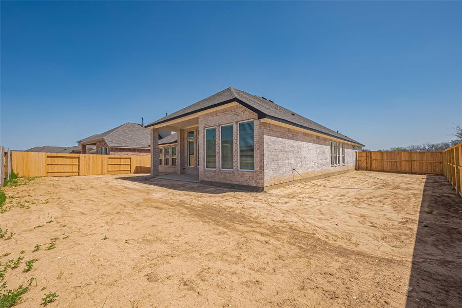 Exterior details and patio area of a home in La Segarra, Brookshire (Image 26).