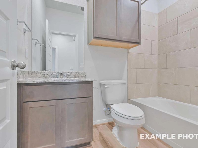 Furnished interior view inside a new home in Caney Creek Place, Conroe (Image 14).