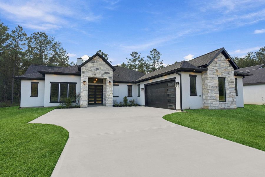 Front exterior of a new home in , Dayton, TX, highlighting curb appeal (Image 2). Front exterior of a new home in , Dayton, TX, highlighting curb appeal (Image 2).