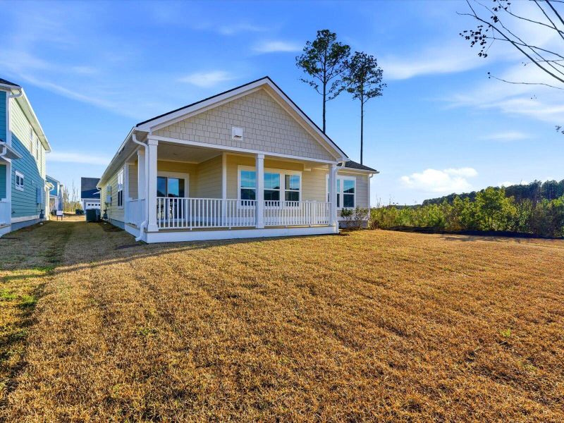 Exterior details and patio area of a home in The Coves at Lakes of Cane Bay, Summerville (Image 28). Exterior details and patio area of a home in The Coves at Lakes of Cane Bay, Summerville (Image 28).