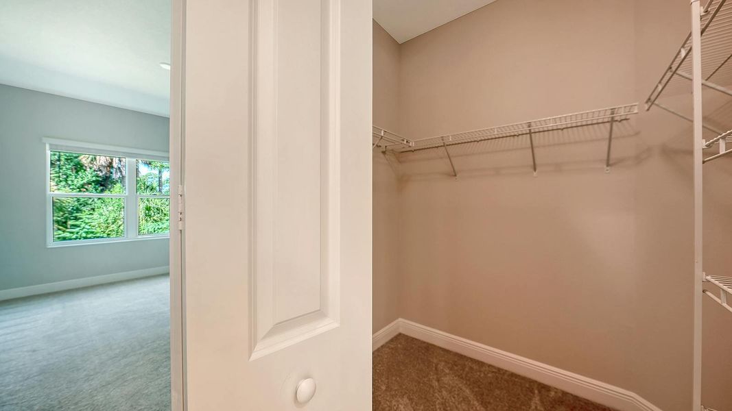 Spacious, unfurnished interior of a new home in Wildleaf Real Estate and Homes for Sale in Parrish, FL - Neal Communities, Parrish (Image 31).