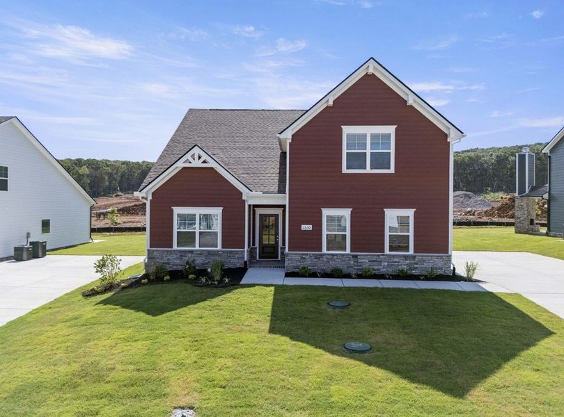 Front exterior of a new home in Brewer Point, Murfreesboro, TN, highlighting curb appeal (Image 1). Front exterior of a new home in Brewer Point, Murfreesboro, TN, highlighting curb appeal (Image 1).