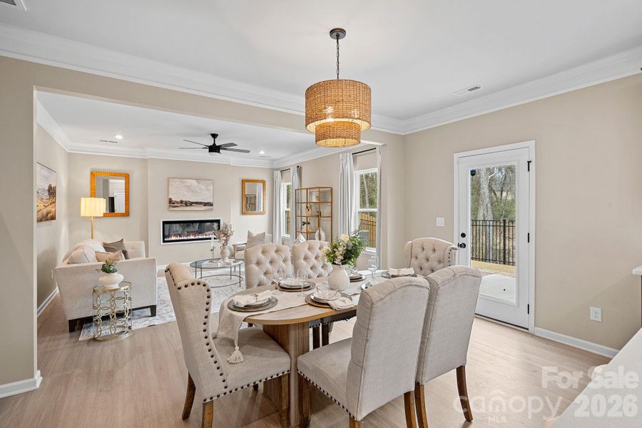 Dining area off the kitchen with upgraded light fixture. Dining area off the kitchen with upgraded light fixture.