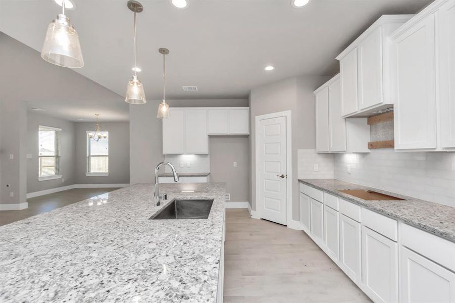 Additional view of your culinary haven with tons of counter space. Sample photo of completed home with similar floor plan. As-built interior colors and selections may vary.